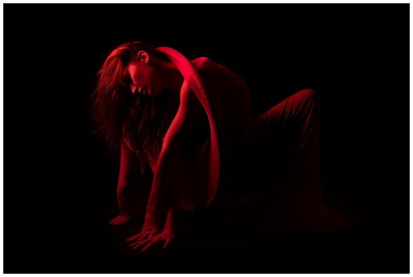 A striking portrait of a female dancer posing arti