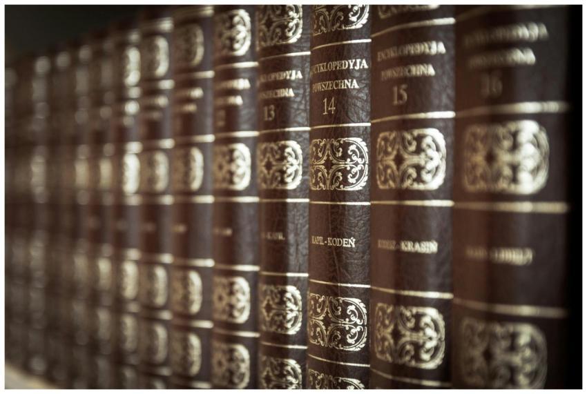 A close-up view of vintage encyclopedias on a libr