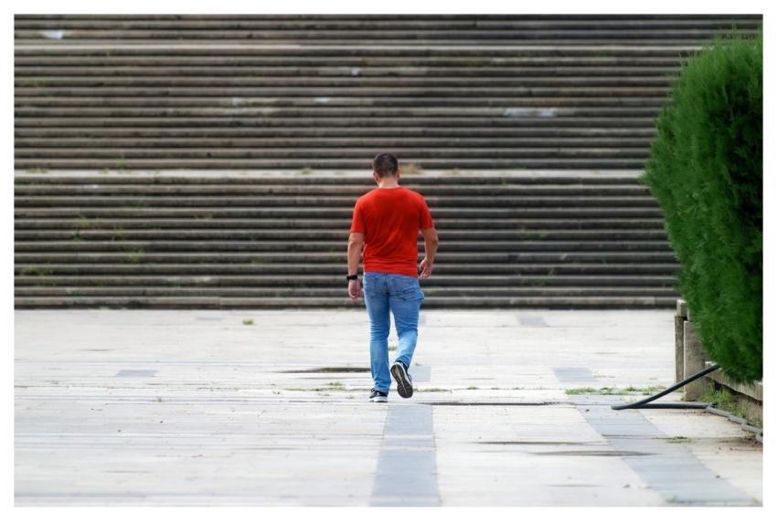 Man Casual Walking Pavement