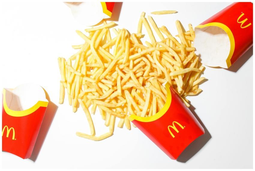 Delicious McDonald's French fries spilled on a bri