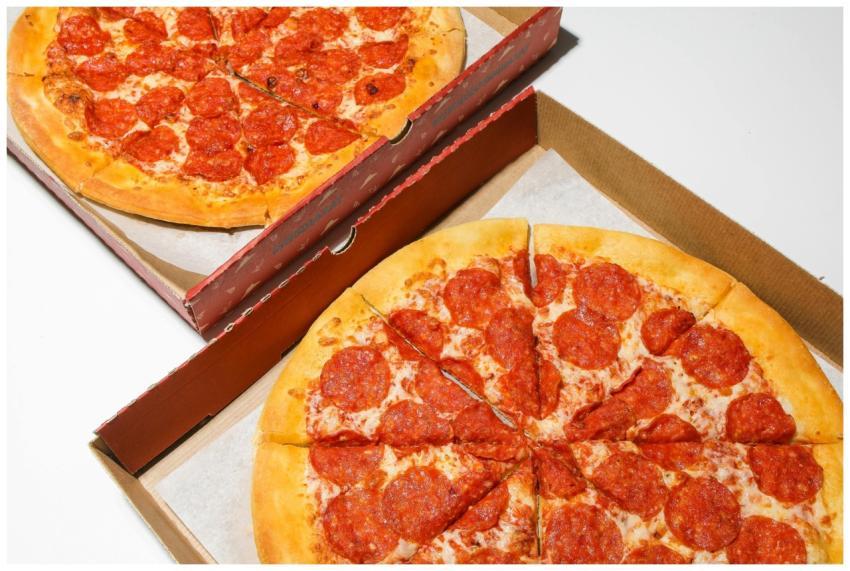 Top view of freshly baked pepperoni pizzas in open