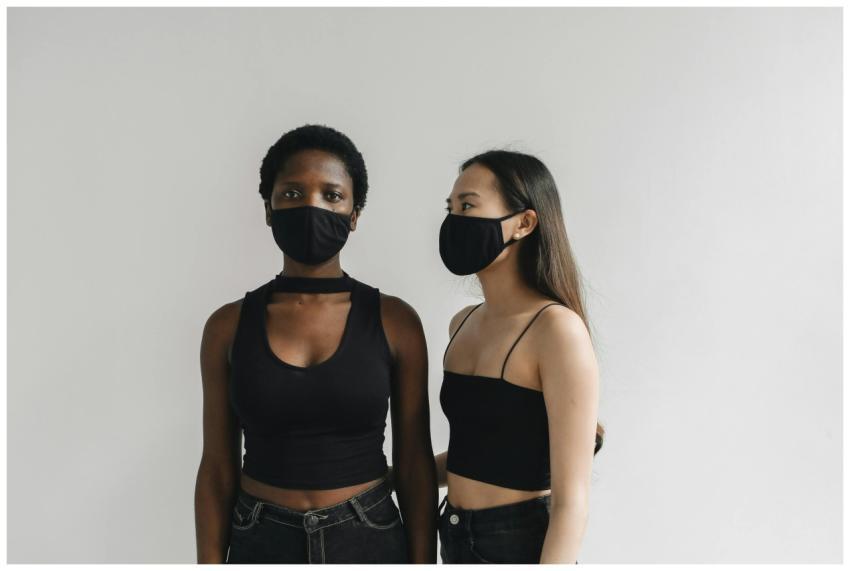 Portrait of two diverse women wearing black outfit