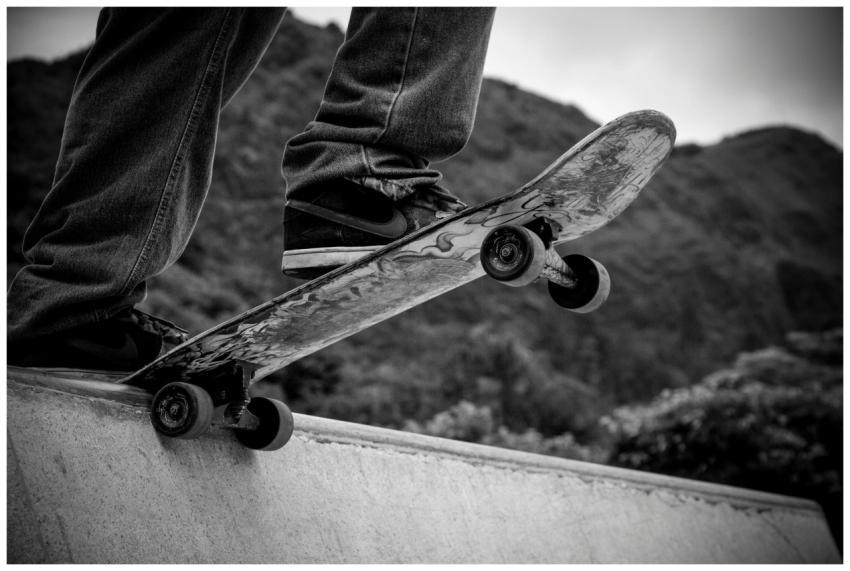 Black and white image of close-up skateboard actio
