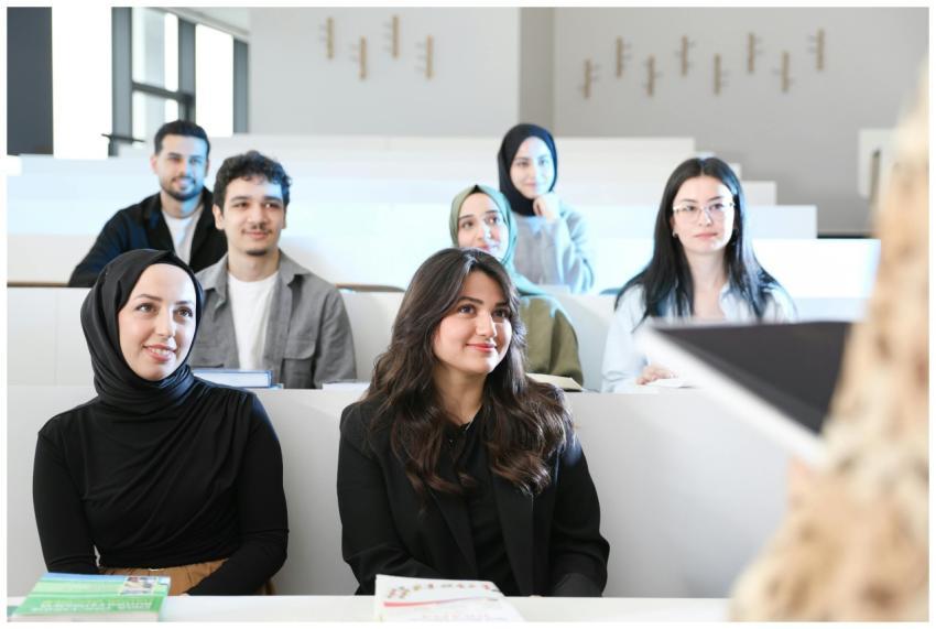 Diverse group of students attentively listening in