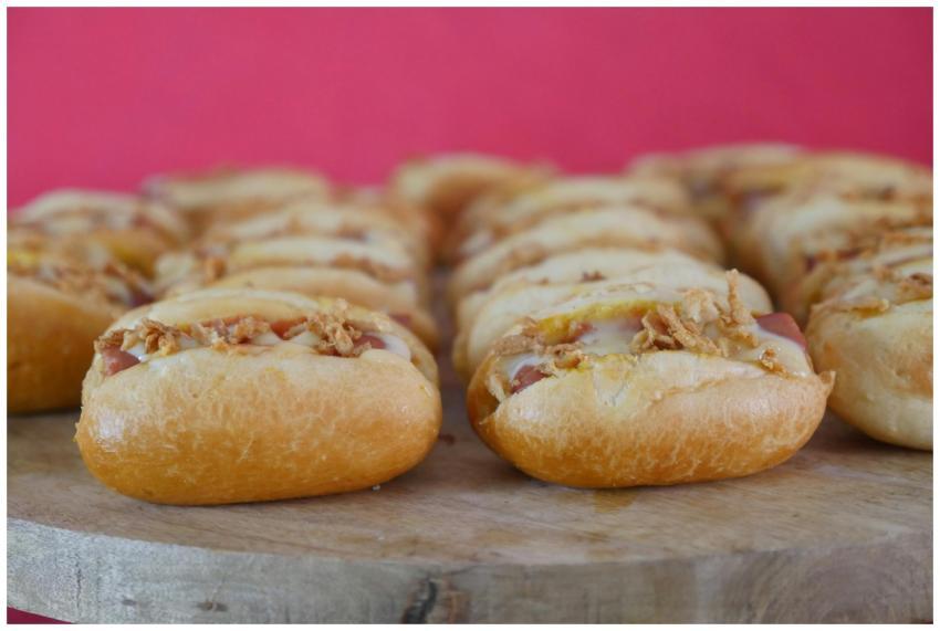 Close-up of delicious mini hotdogs topped with cru