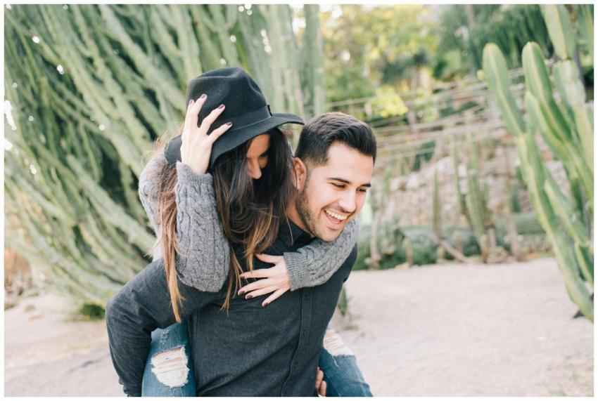 Happy couple enjoying a playful piggyback ride sur