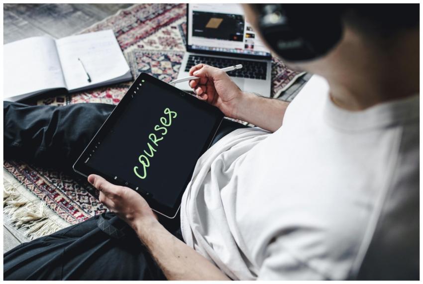 Person studying online courses using a digital tab