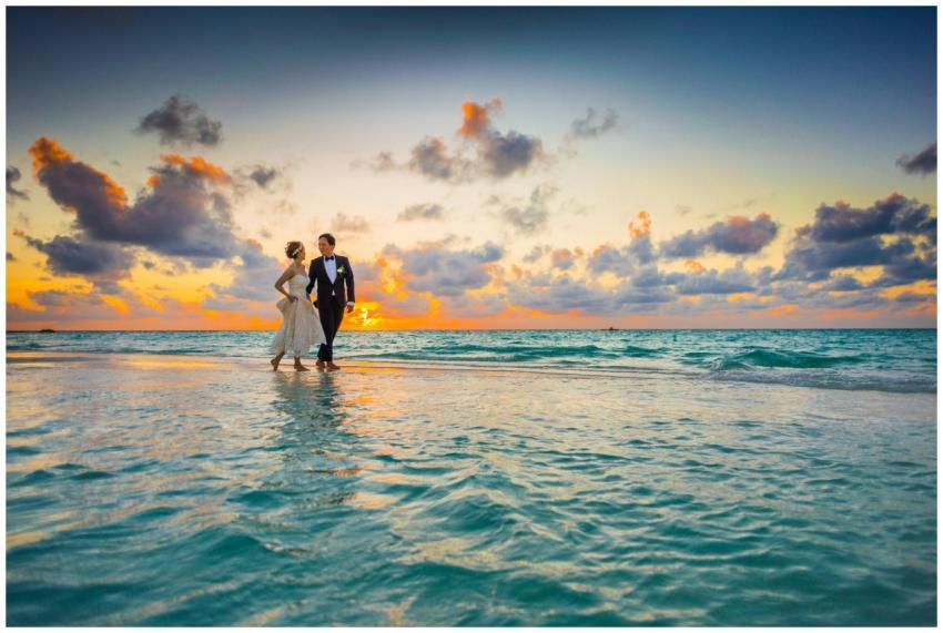 A young couple enjoying a romantic beach wedding d