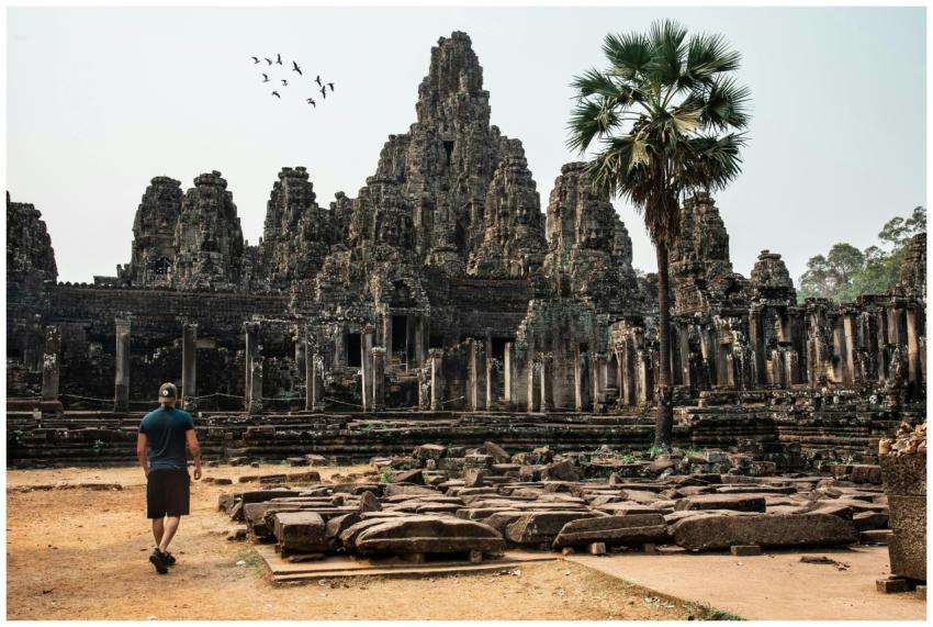Traveler exploring the ancient Bayon Temple at Ang