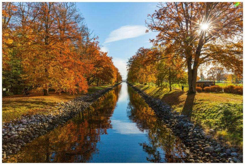 A picturesque canal scene in Horten, Norway, showc