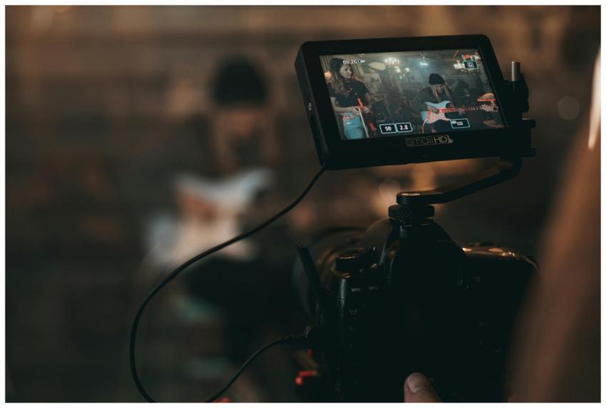 A cinematic close-up of filming a rock band perfor