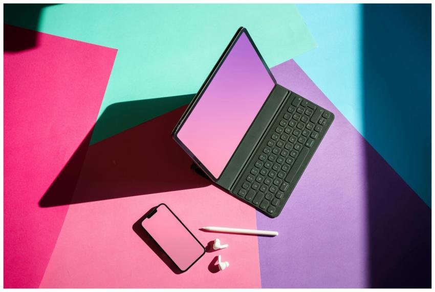Vibrant flat lay featuring a tablet, smartphone, a
