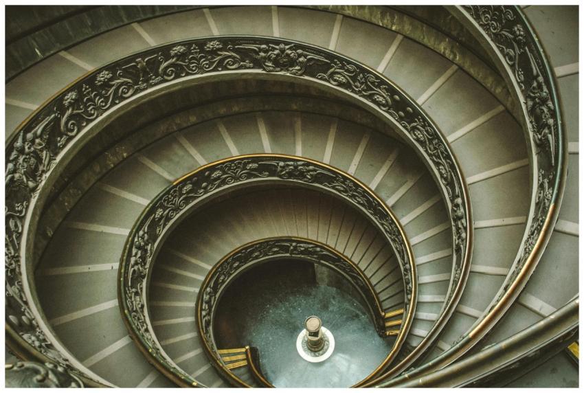 Intricate spiral staircase with ornate handrails i