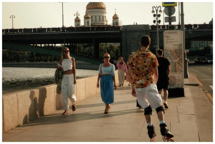 Casual stroll along riverside promenade with iconi
