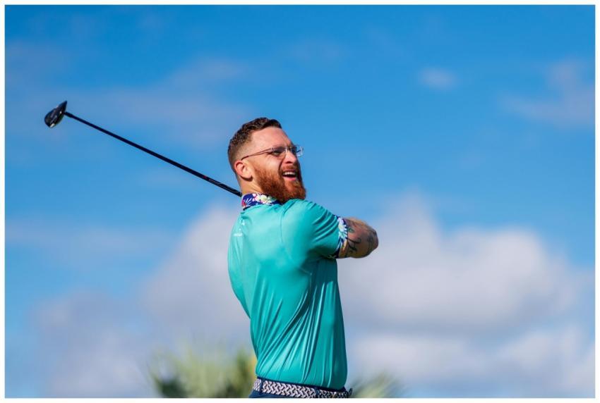 A male golfer enjoying a precise golf swing on a c