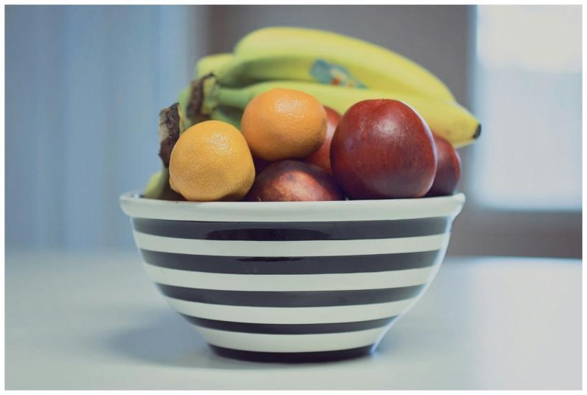 A vibrant assortment of fresh fruits in a striped