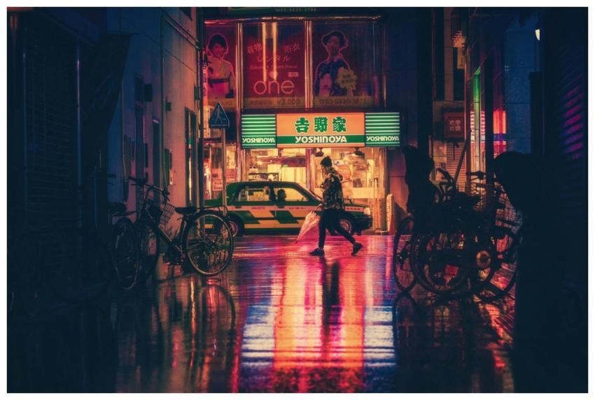 Atmospheric night cityscape featuring neon lights,