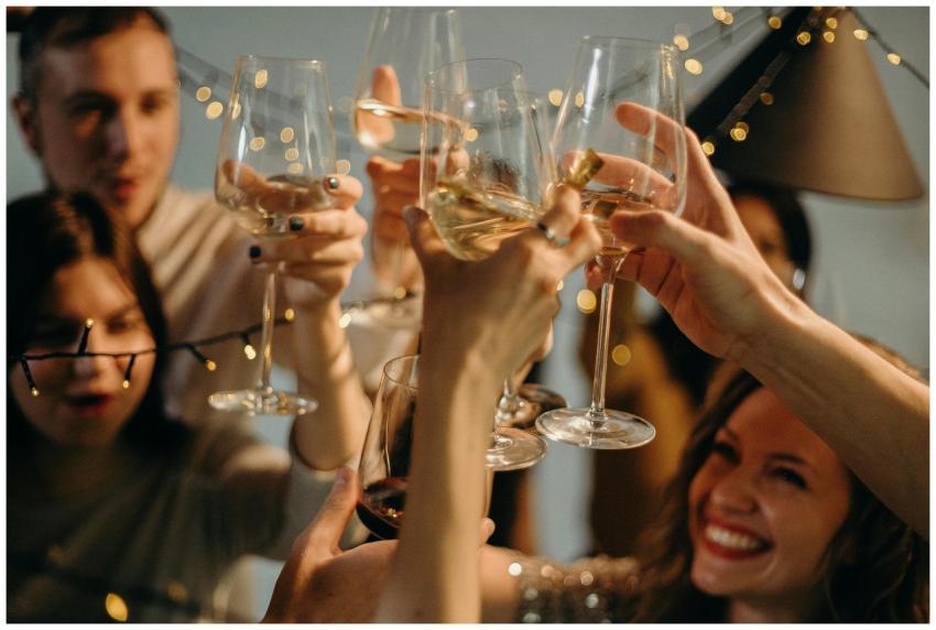 A group of friends joyfully toasting with champagn