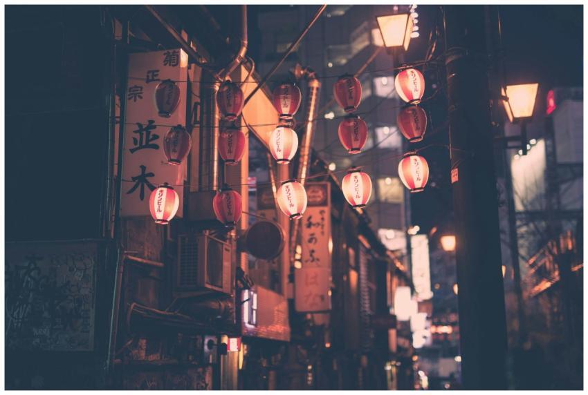 Moody night street with red lanterns in Tokyo Japa