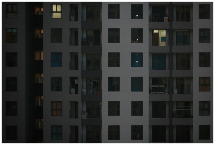 A detailed view of a modern apartment building fac