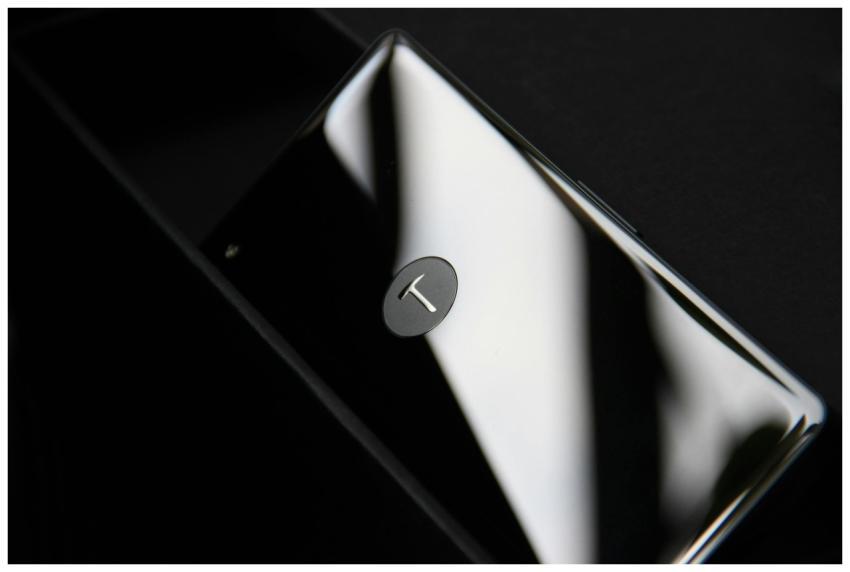 Elegant smartphone with chrome finish reflecting l