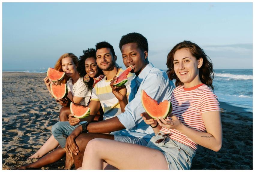 Young content multiracial friends enjoying sweet r