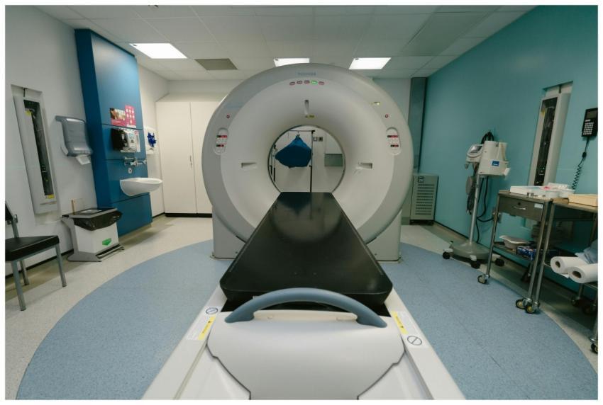 A high-tech MRI machine in a spacious hospital exa