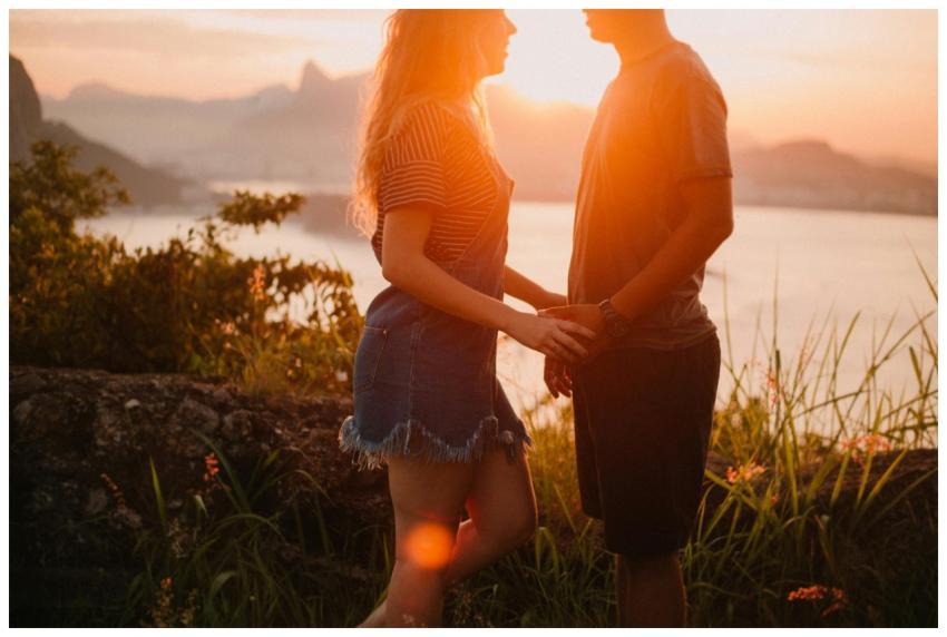 A couple enjoys a romantic sunset overlooking Rio'