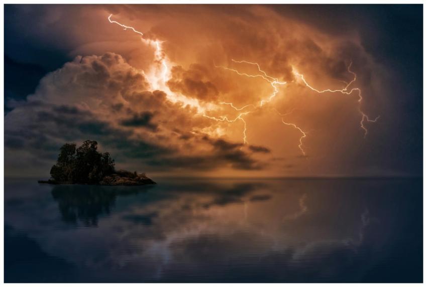 Stunning scene of lightning striking over a small
