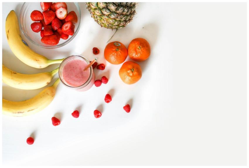 A vibrant flat lay of tropical fruits including ba