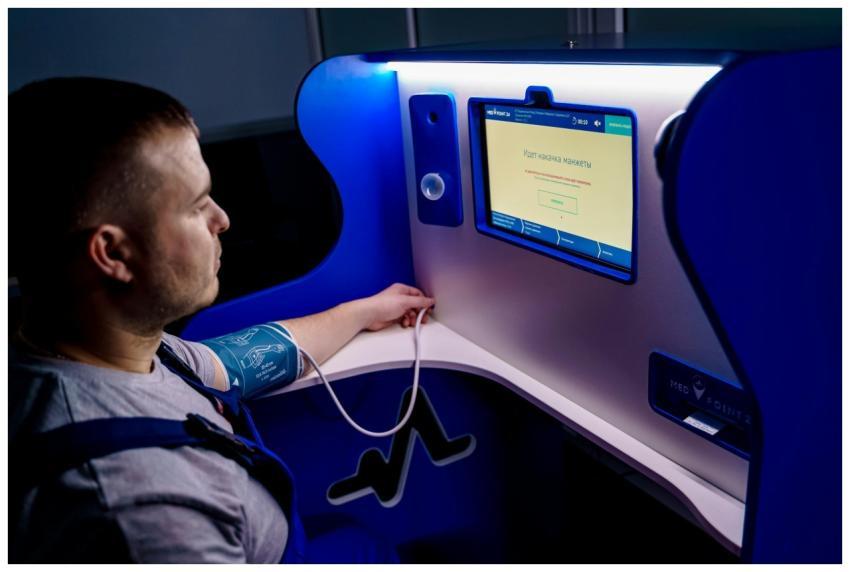 Man measuring blood pressure with a digital monito