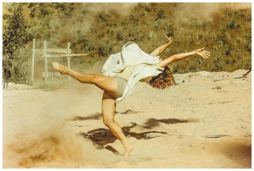 Graceful dance captured mid-motion in a sunlit san