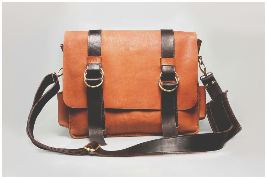 Elegant brown leather briefcase with dark straps a