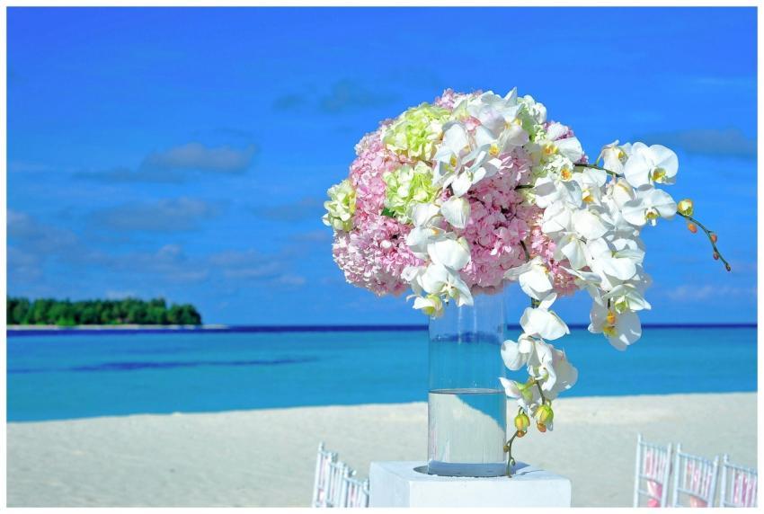 A vibrant floral bouquet setup on a sunny tropical