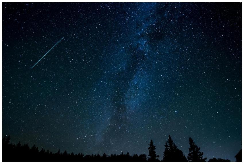 A breathtaking view of the starry night sky with a