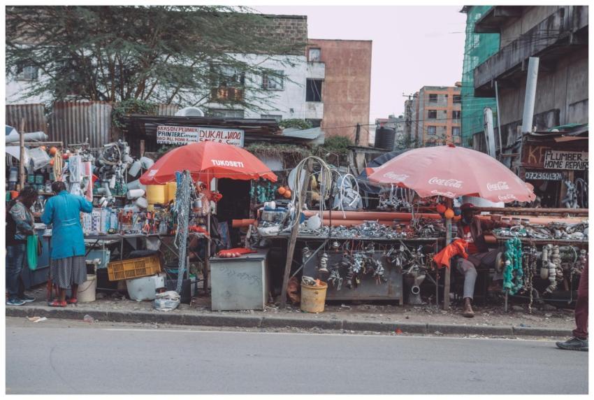 A bustling urban street market scene with vendors