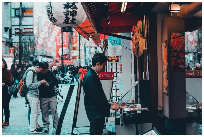 Bustling urban street market with paper lanterns a