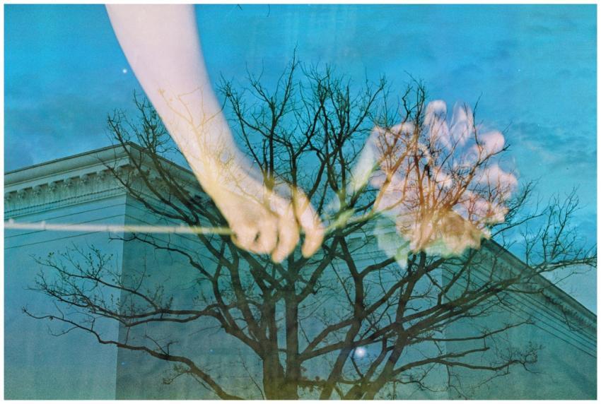 Artistic double exposure photograph of hands with