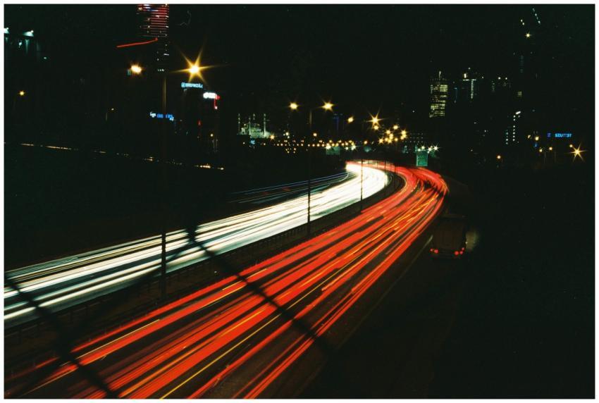 Long exposure of bustling city highway at night wi