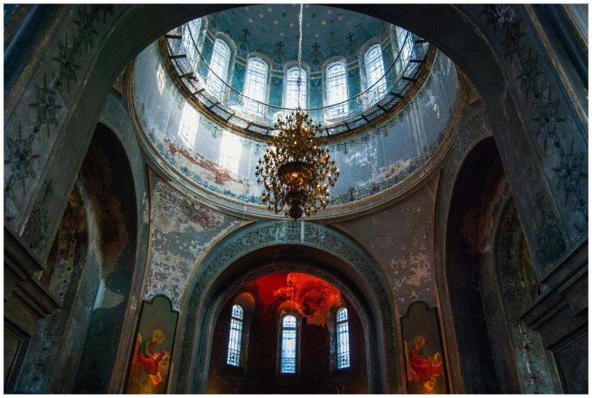 Elegant interior of an old chapel with a chandelie