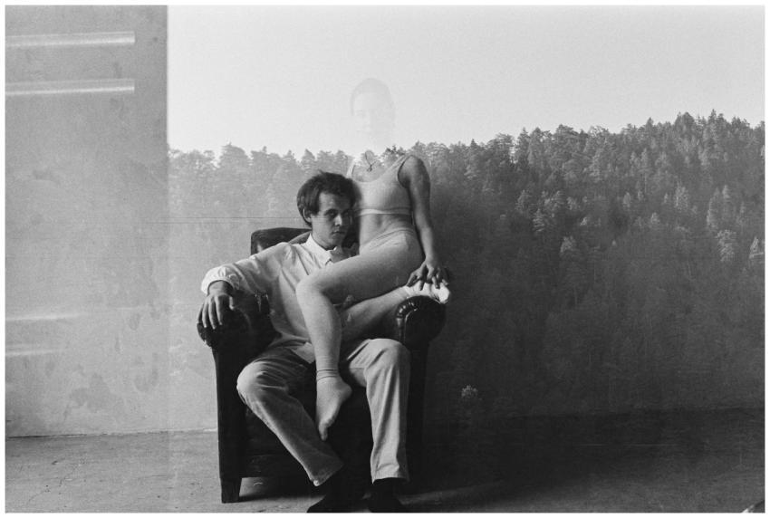 Artistic double exposure of a couple in an indoor