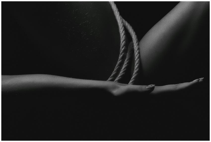 Dark artistic monochrome image featuring close-up