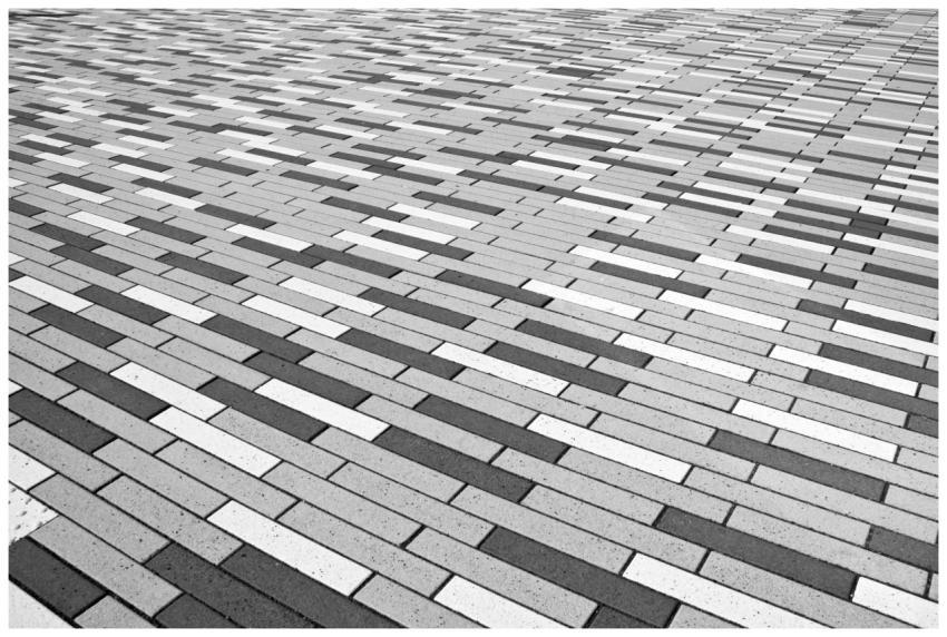 Abstract black and white patterned brick floor pro