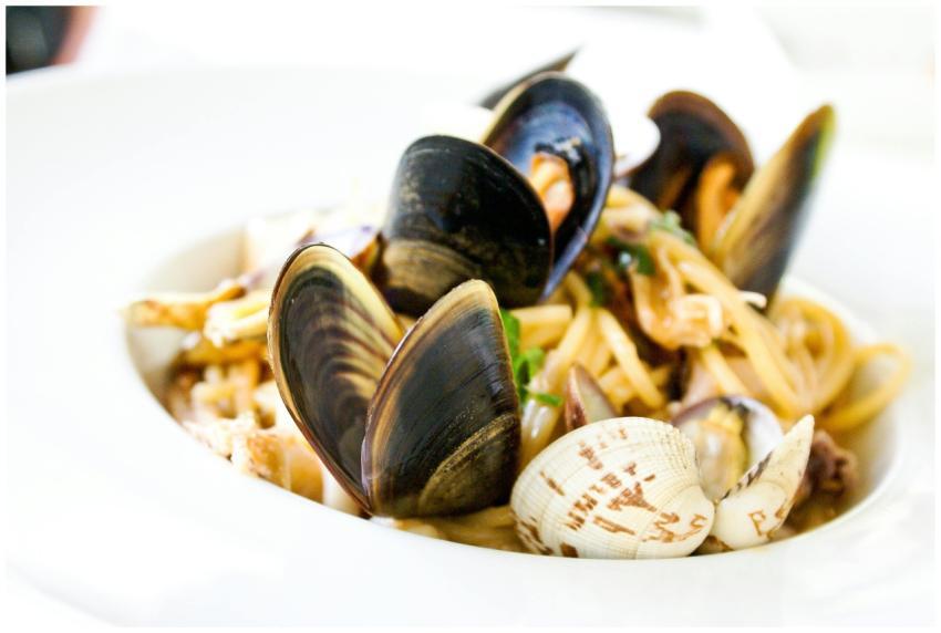 Close-up of Italian seafood pasta with clams and m