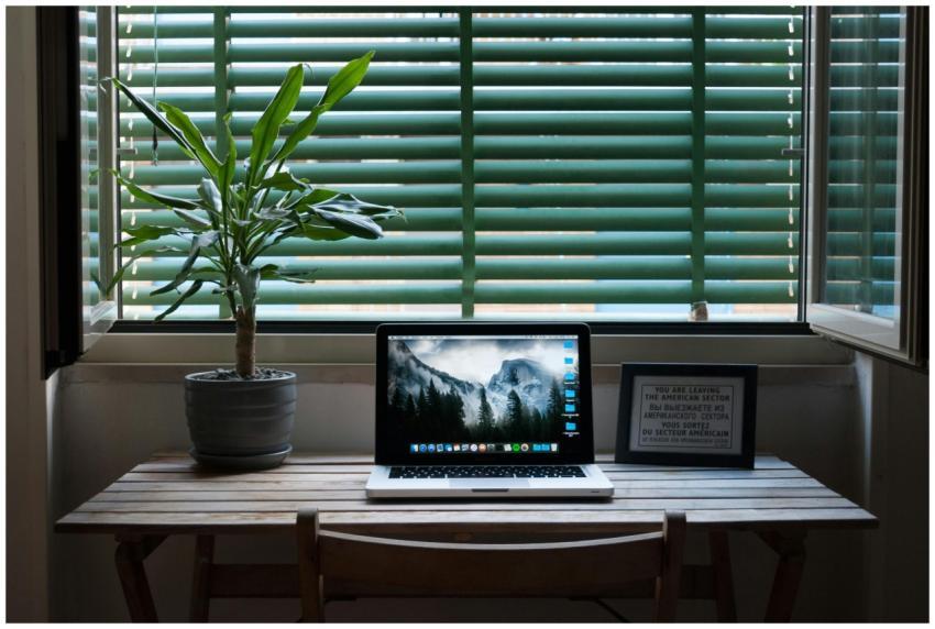 Elegant home office desk setup with a laptop and a