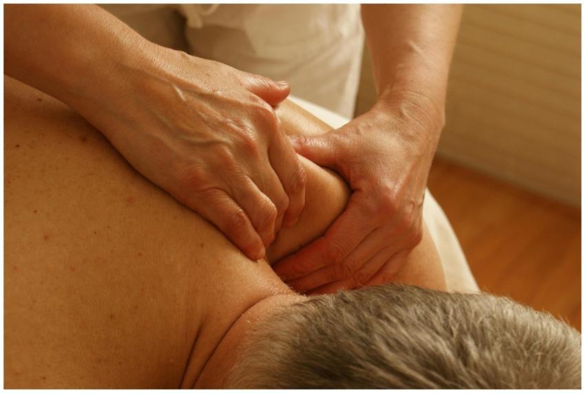 Close-up of a therapist giving a relaxing shoulder