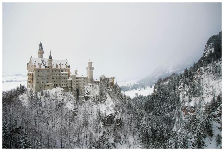 Majestic Neuschwanstein Castle surrounded by snowy