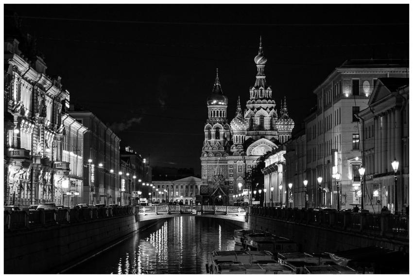 A stunning black and white night view of a canal w