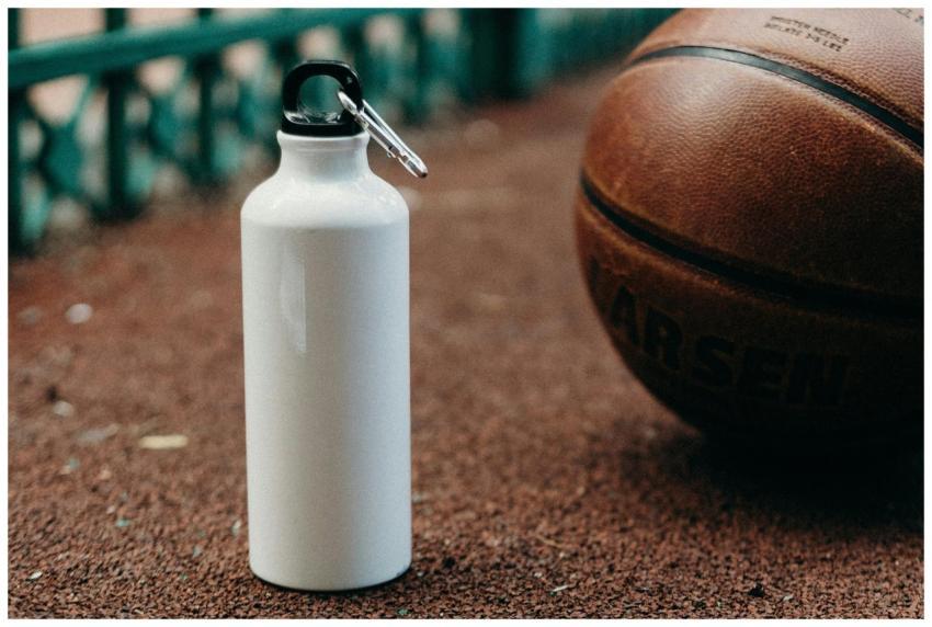 White water bottle and basketball on outdoor sport