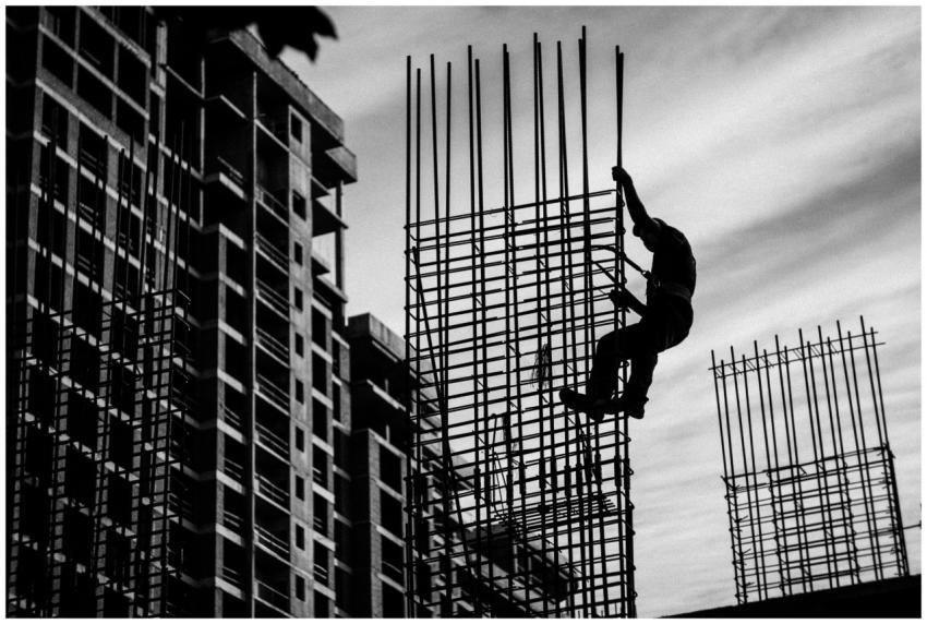 Black and white silhouette of a construction worke